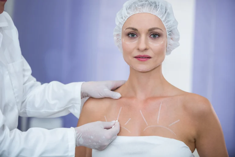 doctor marking female patients body breast surgery