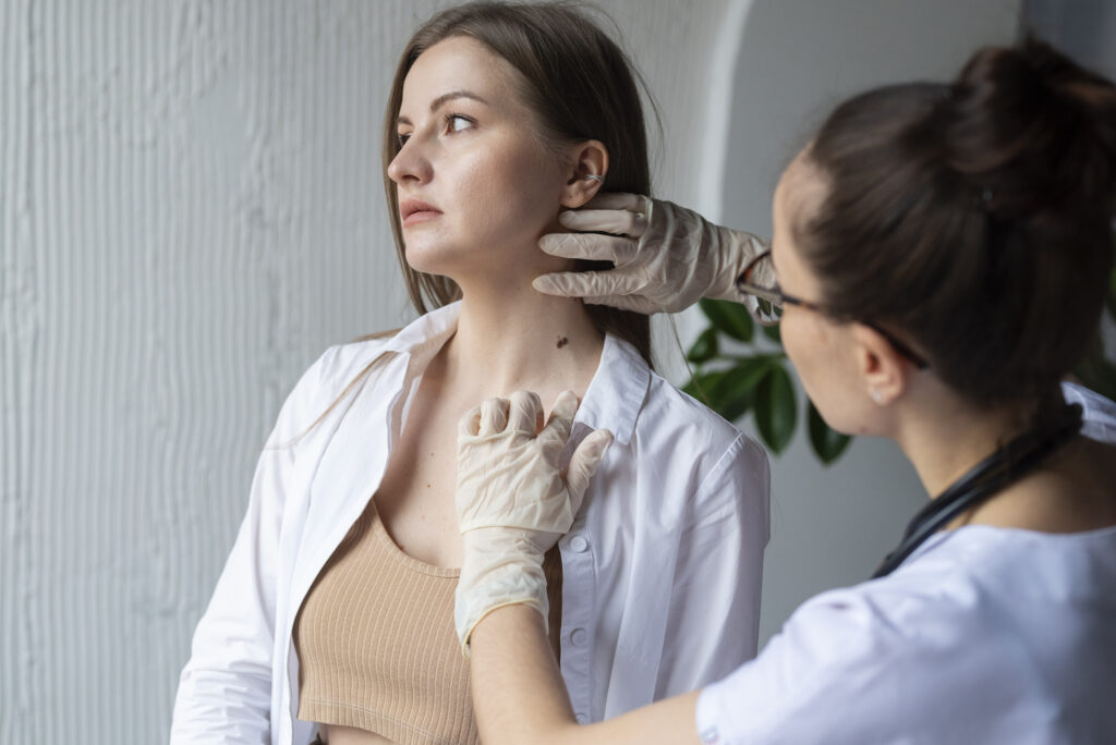 female doctor diagnosing melanoma body female patient 2