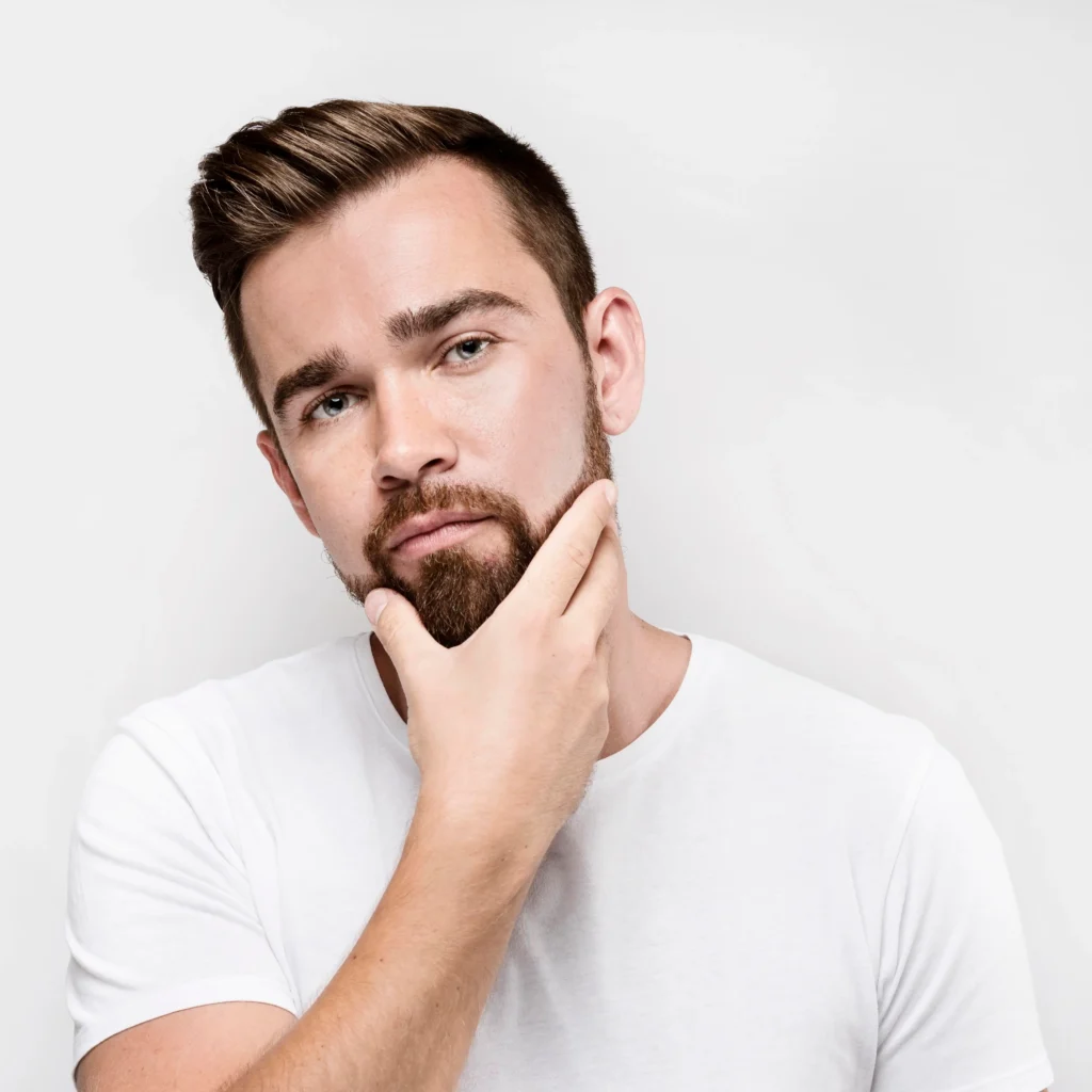 front view man holding his beard