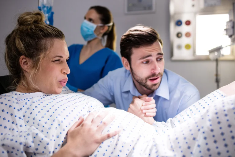 man comforting pregnant woman labor 1