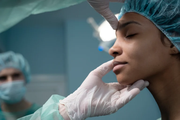 side view doctor checking patient before rhinoplasty 1