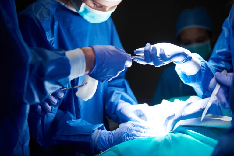 surgeons passing scissors each other