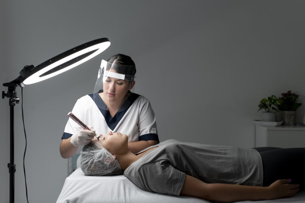 caucasian woman going through microblading treatment