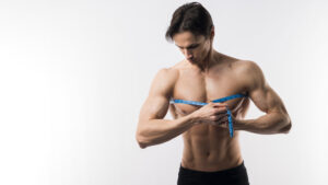 front view muscled man measuring chest