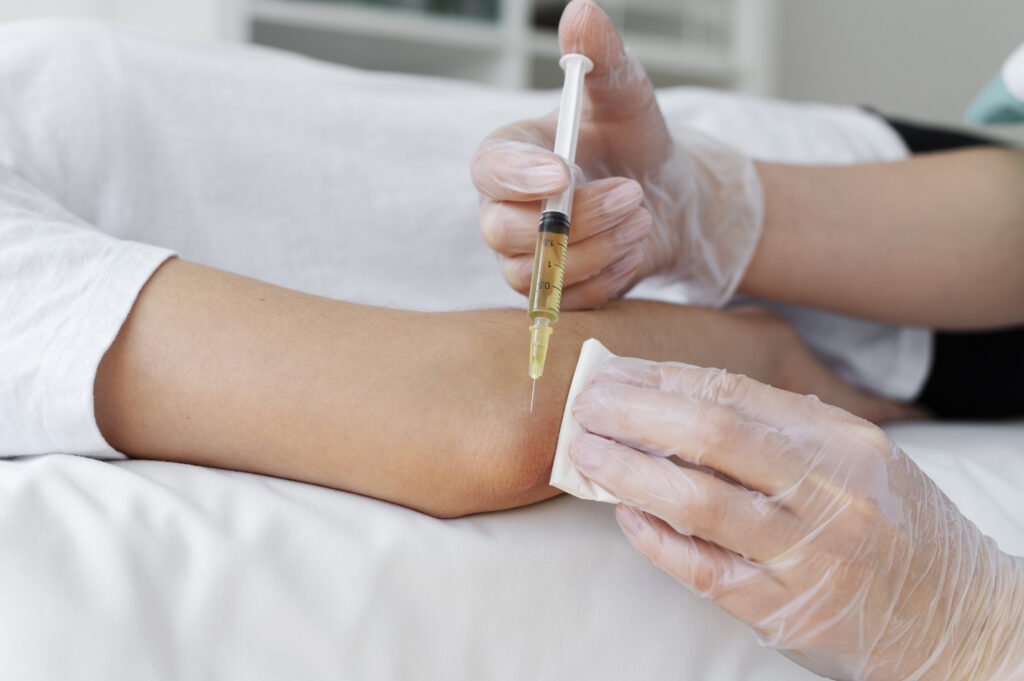 high angle patient getting elbow prp treatment