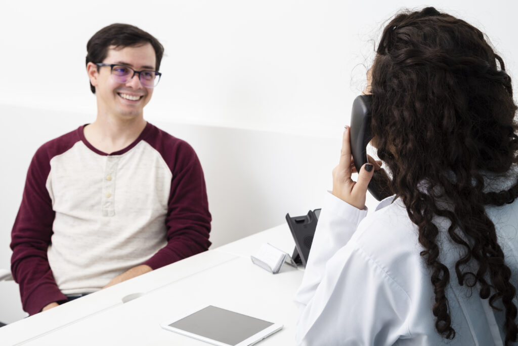 medium shot doctor talking phone