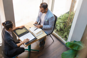 view serious business partners having meeting cafe