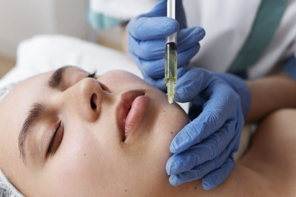 low angle woman getting face prp treatment