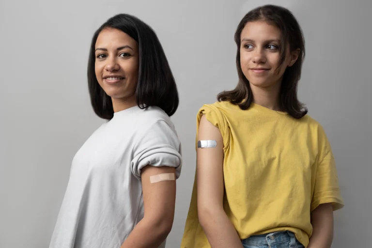medium shot smiley women wearing band aids