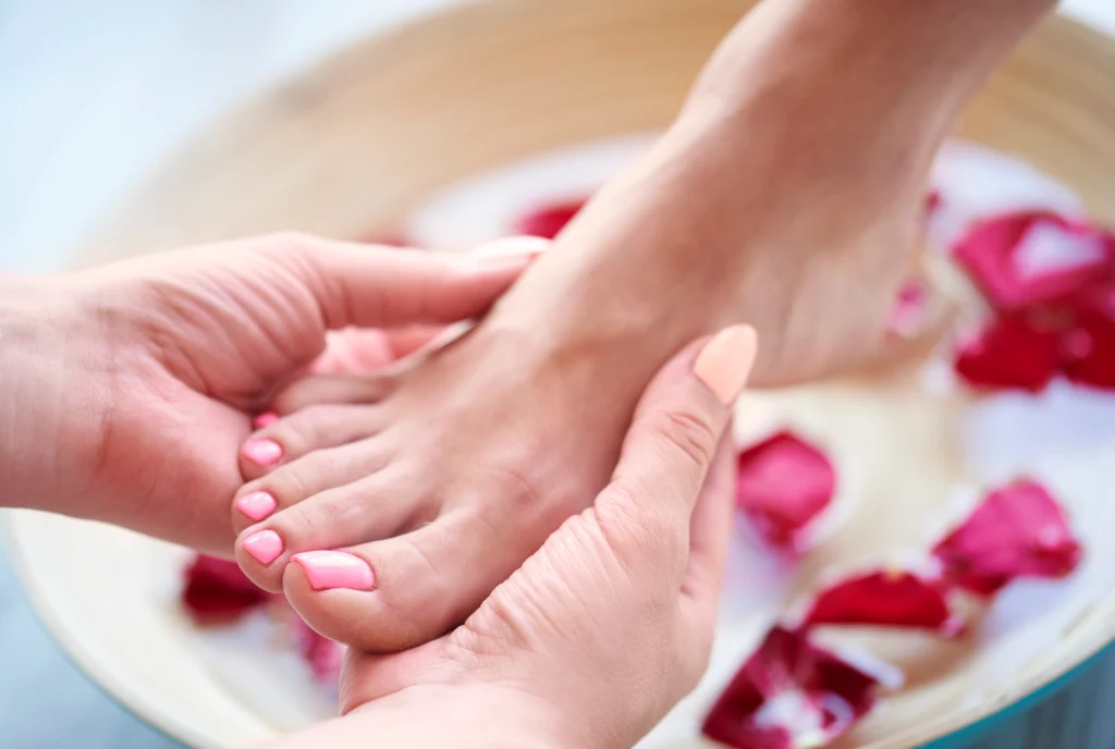 woman s feet bowl with water petal