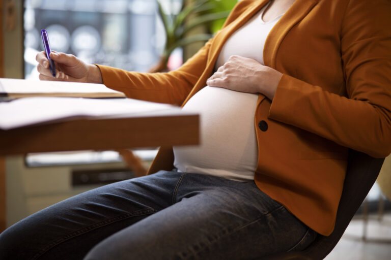 young pregnant woman work